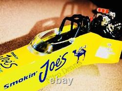 NHRA Jim Head CAMEL Top Fuel NITRO Drag Racing 124 Diecast SMOKIN JOES Dragster
<br/>  
 
   <br/>
Translation in French: NHRA Jim Head Top Fuel NITRO Drag Racing 124 Diecast SMOKIN JOES Dragster Camel